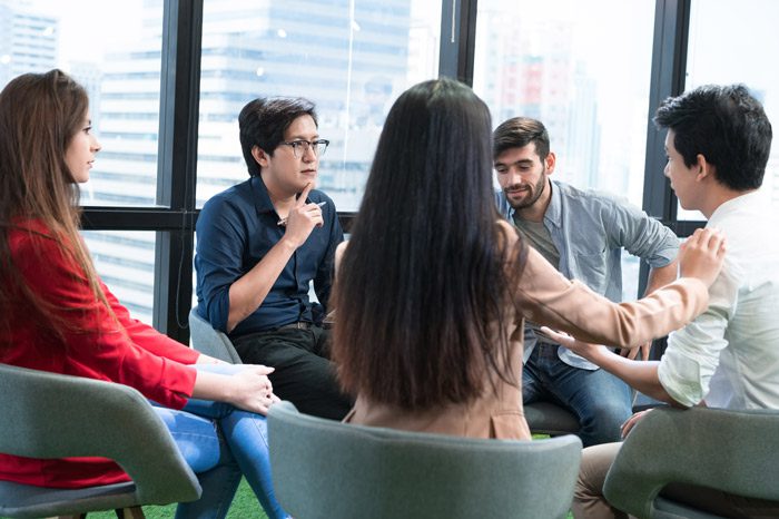 Intervention, group of family and friends in a circle talking - intervention