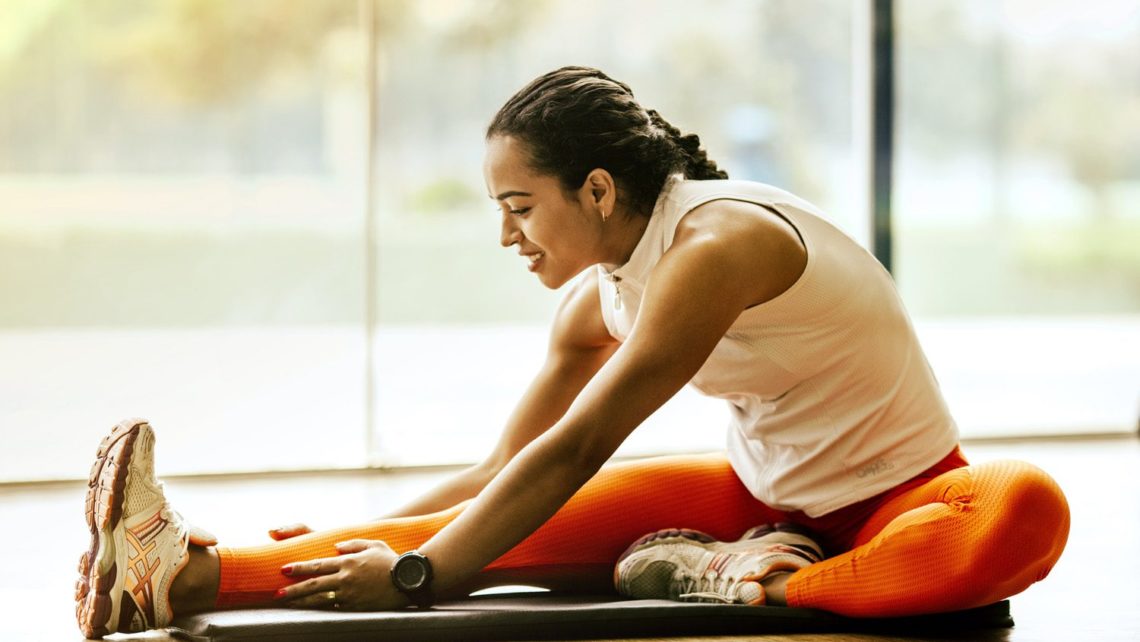 Manage Chronic Pain, Woman Stretching on Ground